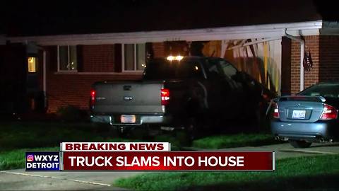 Truck crashes into home in Farmington Hills