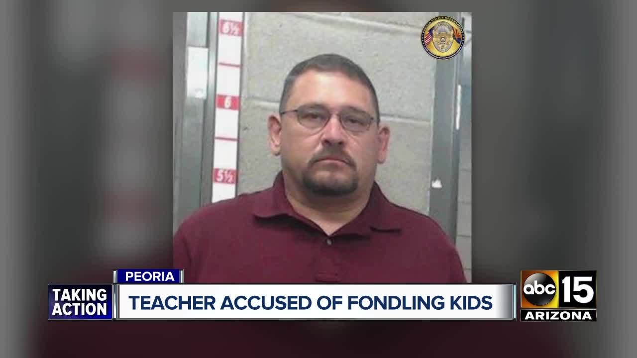 Peoria teacher arrested, accused of molesting three children