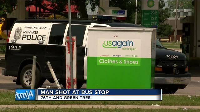 Man shot at bus stop by passing car