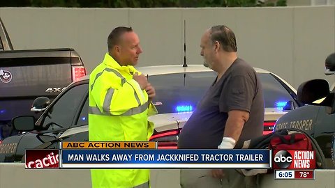 Man walks away from jackknifed tractor trailer