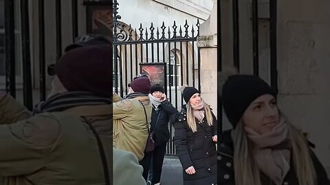 Women tell tourist stop touching the reins