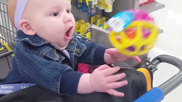 A Baby Girl Discovers A Baby Rattle