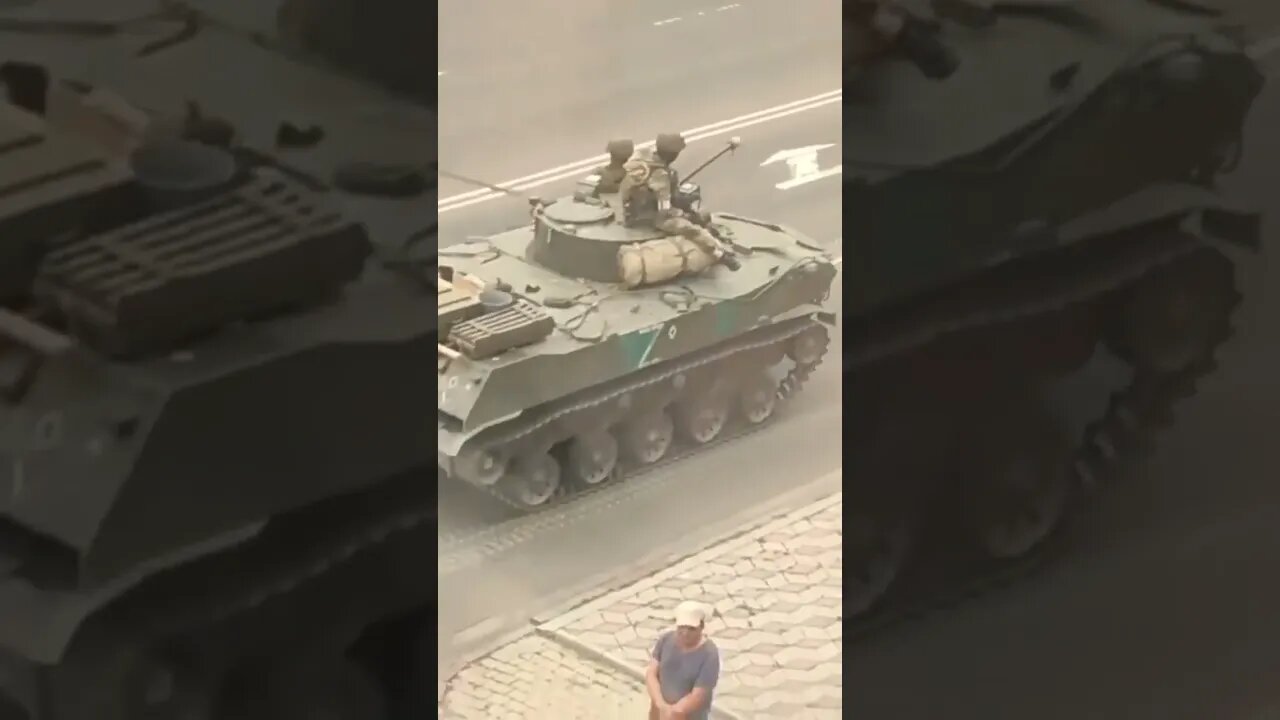 Women on the street Zaporozhye region. They stand and baptize our equipment and our fighters