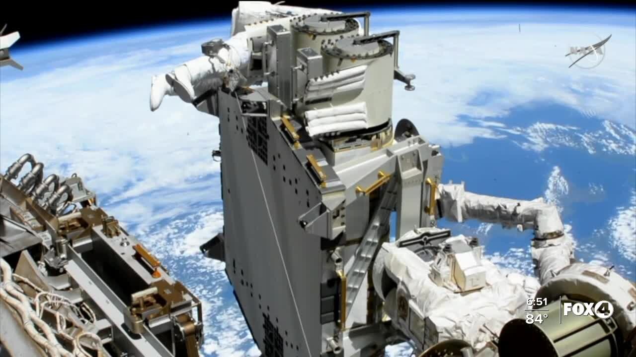 Astronauts install solar panels to space station