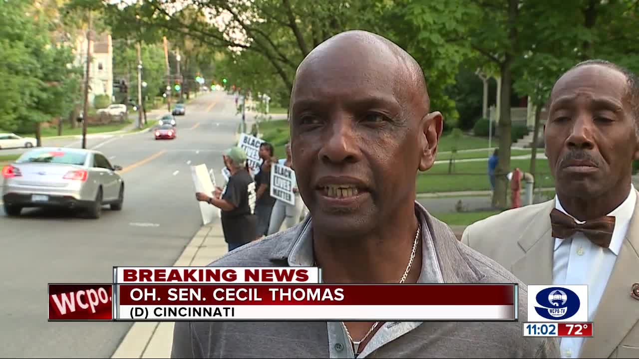 Tracie Hunter supporters demonstrate outside retired judge's home