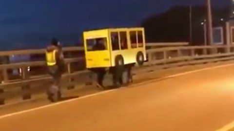 Russians dress as "human bus" in attempt to get across vehicle-only bridge 