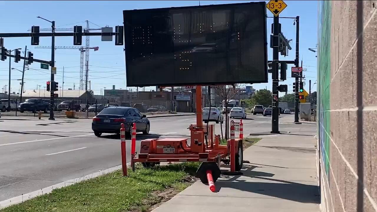 Hacked construction sign catches the eyes of morning commuters in Denver's RiNO neighborhood