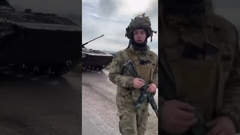 Ukrainian Soldier showcasing an abandoned Russian BMP as well as taunting Russian forces