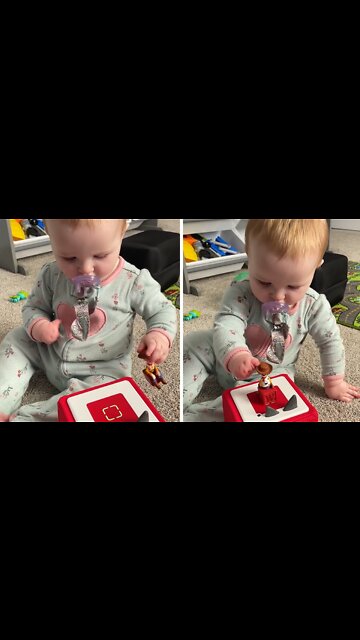 Determined baby overcomes disability to play with toy