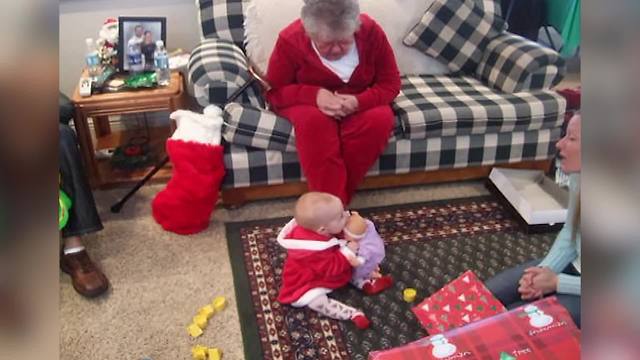 "Excited Baby Girl Gives Her Baby Doll Kisses"