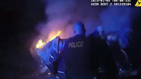 Officer pulls man from burning vehicle after crash