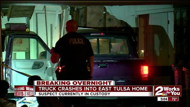 Truck crashes into East Tulsa home