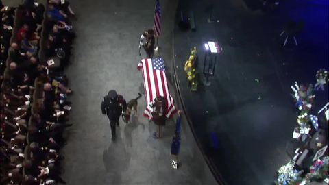 Deputy Pickett's K-9 partner stops in front of his casket