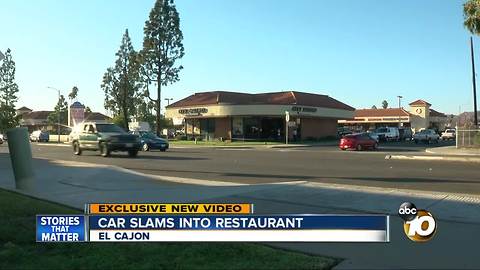 Surveillance video shows car slamming into restaurant