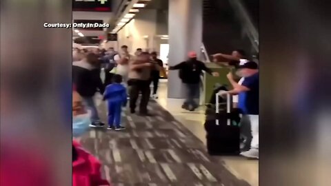 WATCH: Cop Pulls Gun During All-Out Brawl At Miami International Airport!