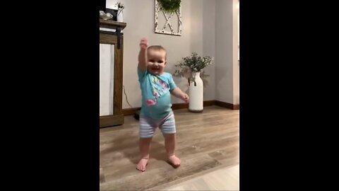 the child is so happy that he is dancing