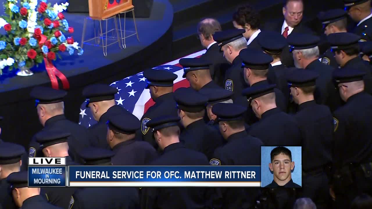 Surrounded by MPD, Rittner's casket is covered with the American Flag