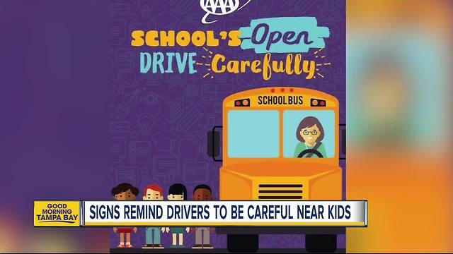 AAA signs popping up near busy roads and school zones reminding people to be careful around kids