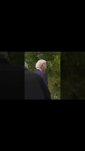 Biden's handlers help him after he gets lost