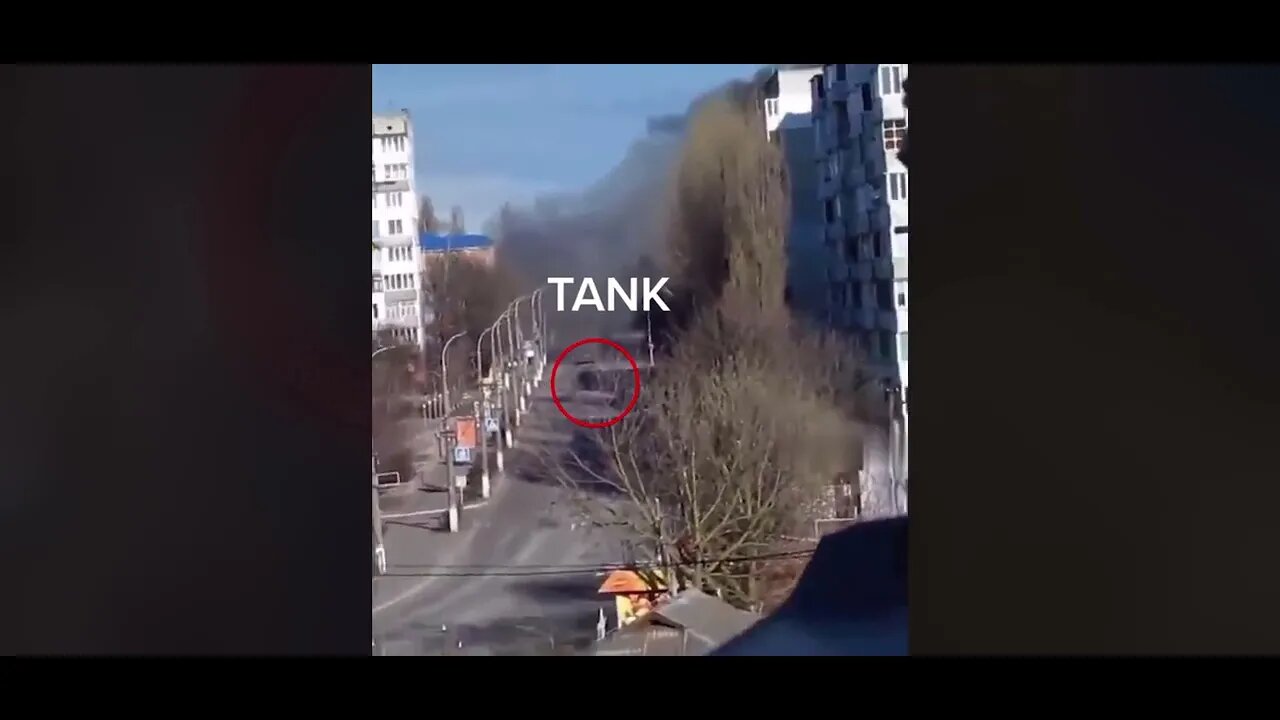 Ukraine War - Russian tank fires towards a building