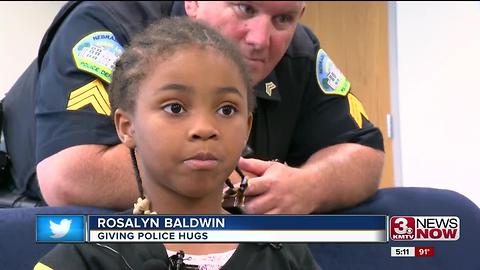 Girl traveling 50 states to hug police officers