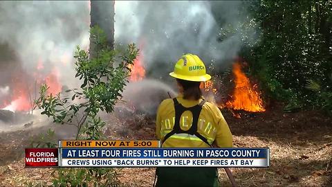 Crews using 'back burns' to help keep fires at bay in Pasco Co.