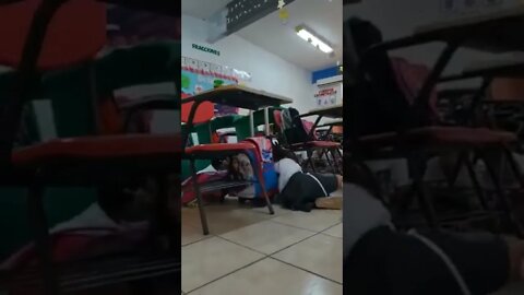 Mexico: Children hiding under their tables during a shooting near their school in Empalme