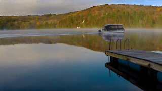 Foggy October lake burn-off. Timelapse