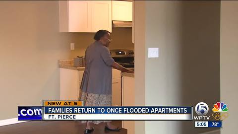 Families return to once flooded apartments