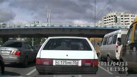 Ambulance flips over in traffic jam in Russia