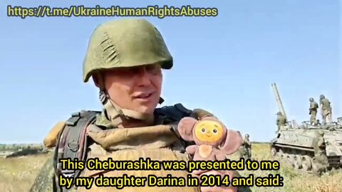 Soldier carries Cheburashka doll given by his daughter in 2014 for protection