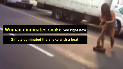 Woman dominates snake on the road in Brazil