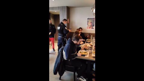 Austrian Police check certificates while people eat