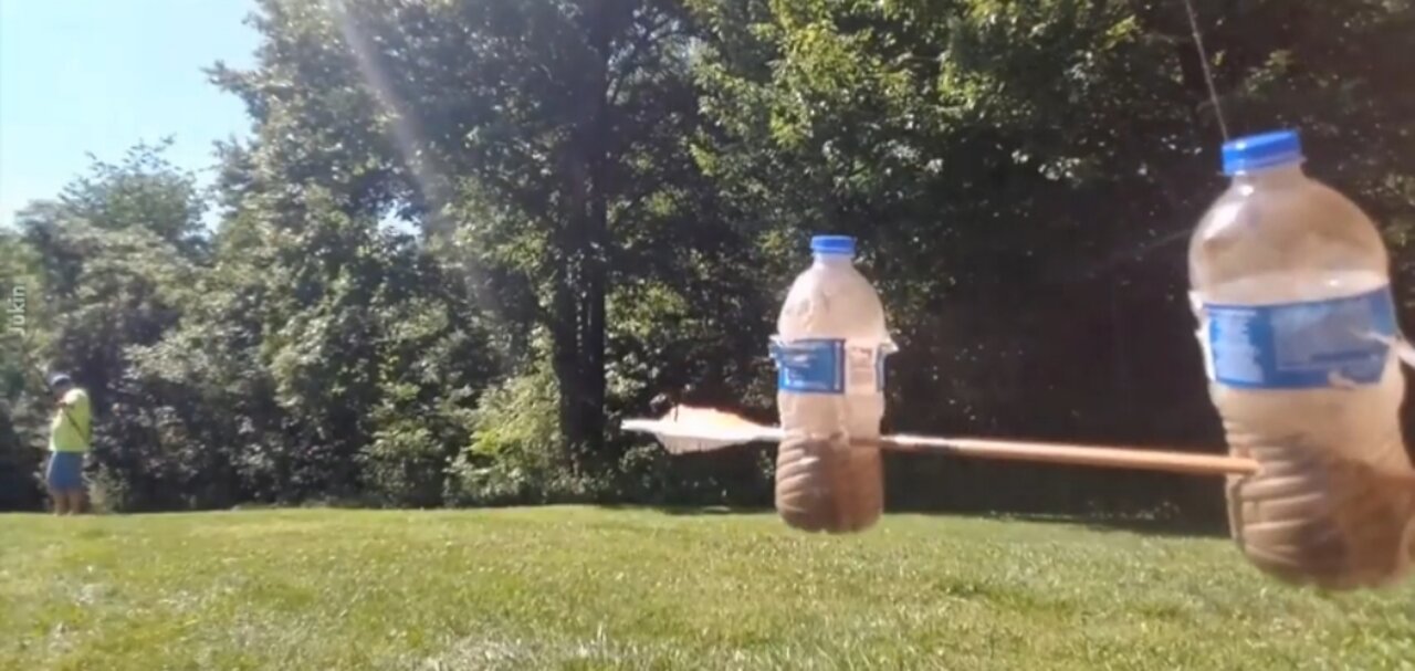 Guy Stops Moving Bottles with Arrow