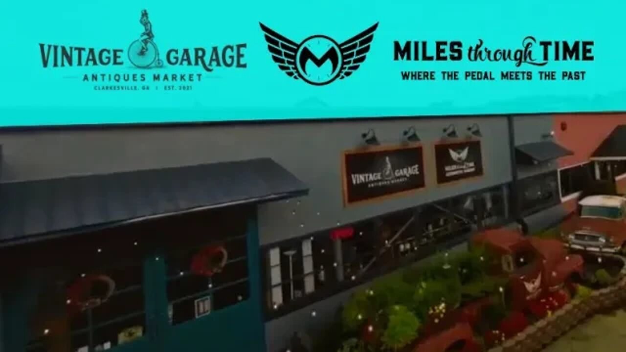 Drone footage of outside Vintage Garage Antiques and Miles Through Time Automotive Museum