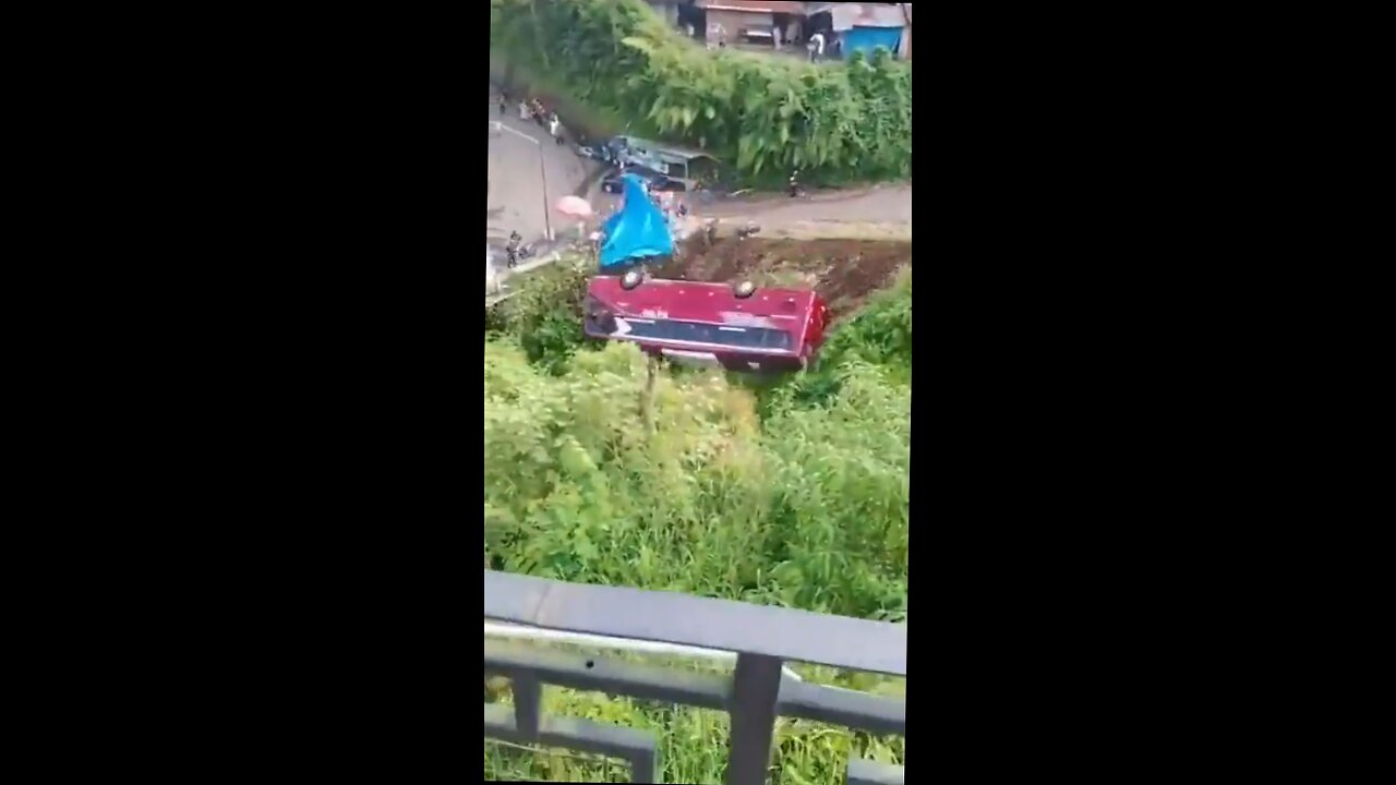 tourist bus rolls out of control into river while passengers scream in terror.