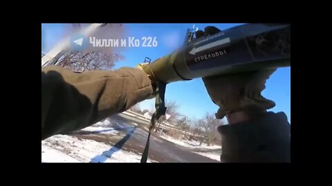 Ukrainian uses a RPG-18 to hit a truck filled with Russian troops