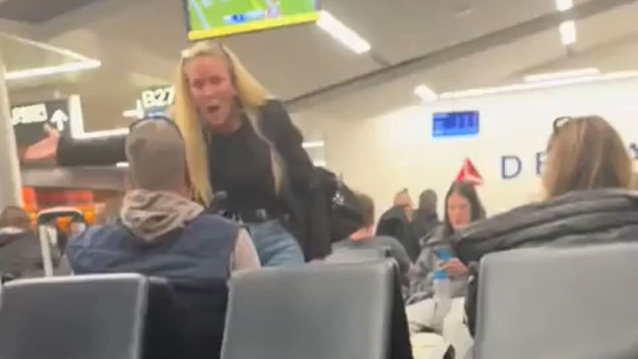 Insane Woman Walks Up To Man She Doesn't Know And Screams Nonsense At Him At Atlanta Airport
