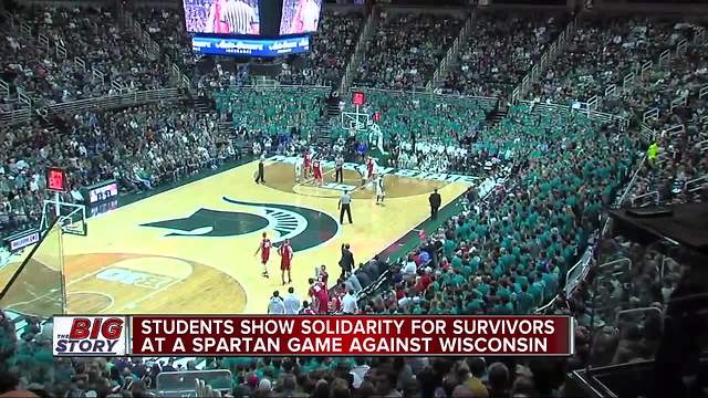 Students show solidarity for survivors at Spartan game against Wisconsin