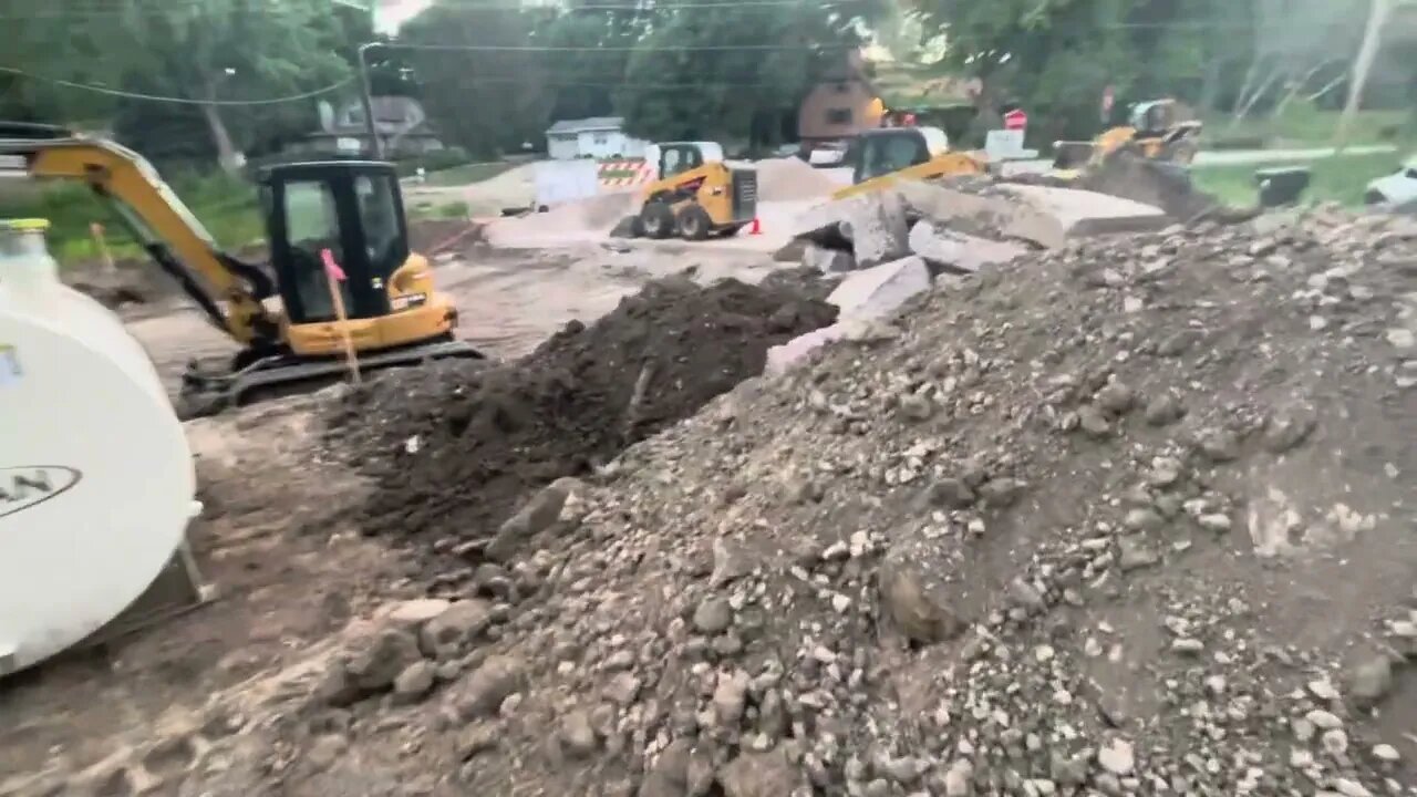 Tear Out of Last Years Temporary Concrete. (Large piles of rocks) Road Construction Project