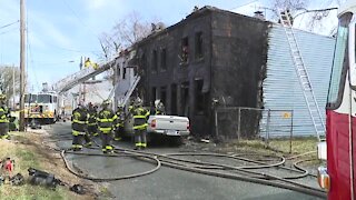 Heavy smoke showing from four homes, Baltimore City Fire on scene