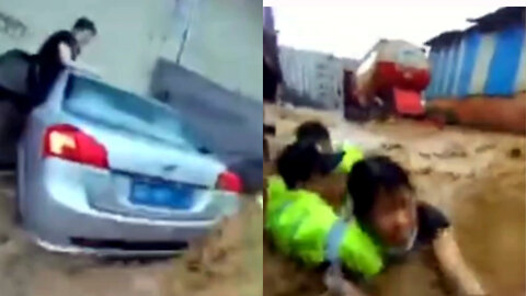 Dramatic Rescue of a Woman From a Car Stuck in Fast-Flowing Floodwater