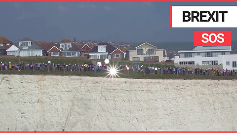 Moment 400 people gathered with mirrors on the south coast to reflect SOS signal to Europe