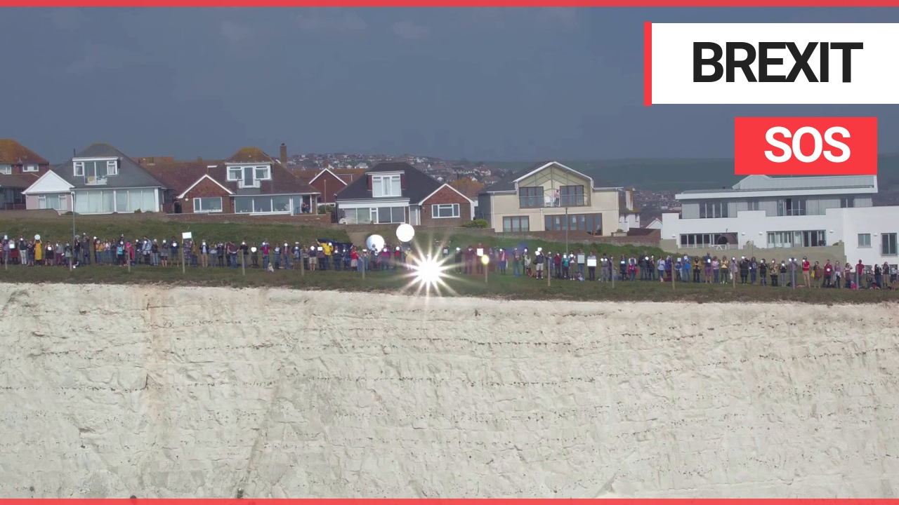 Moment 400 people gathered with mirrors on the south coast to reflect SOS signal to Europe