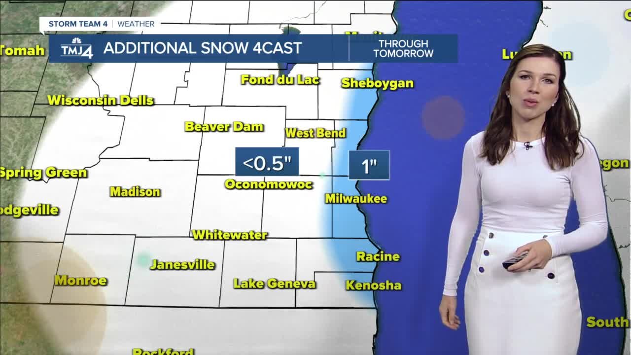 Snow showers continue, then temperatures drop