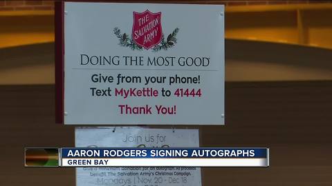 Aaron Rodgers trades signatures for Salvation Army donations