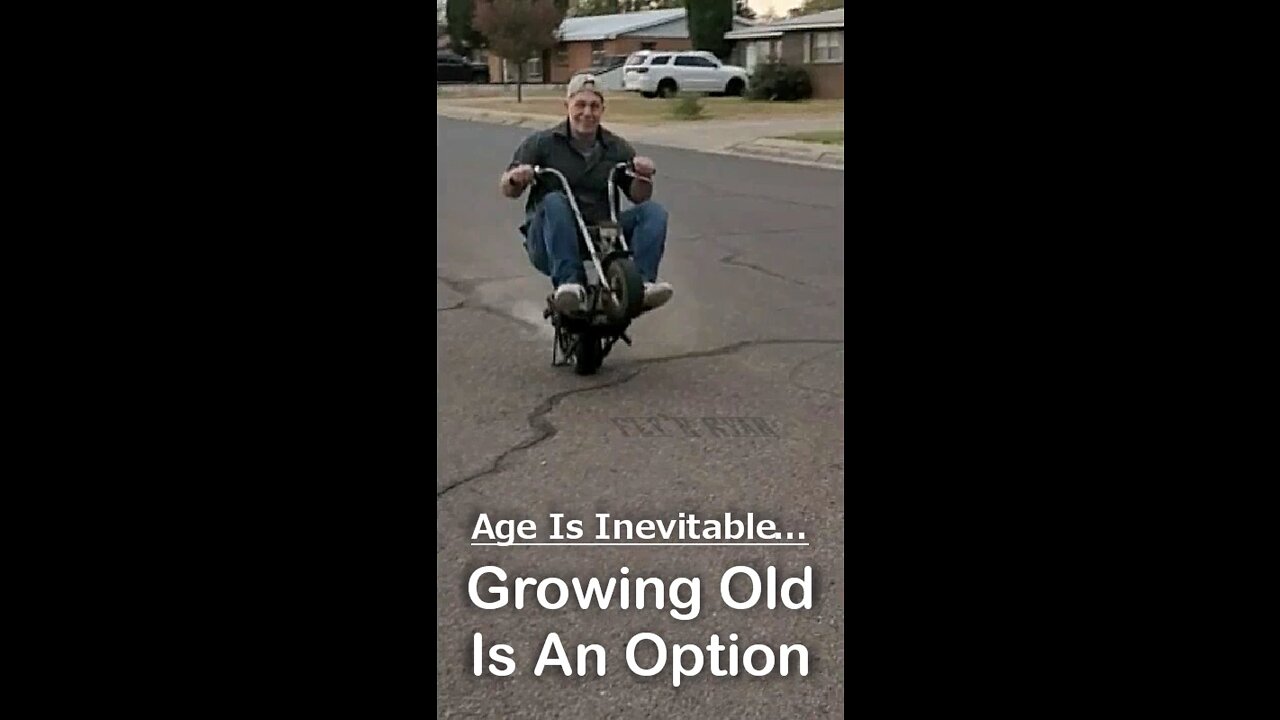 53 year old riding a wheelie on his mini bike.