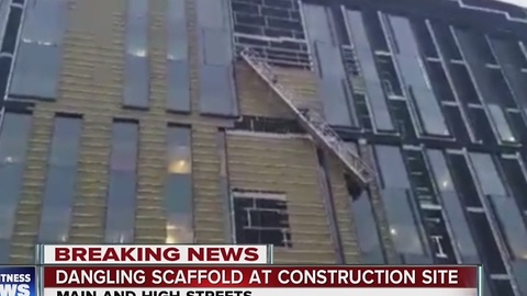 Two people rescued after dangling at construction site