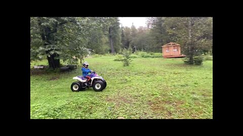 AnnaTommy of a first ATV ride.