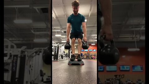 Elevated RDLs with kettlebells